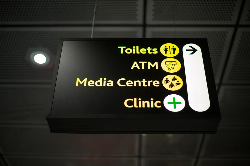 A diverse range of signage, including illuminated external signs,