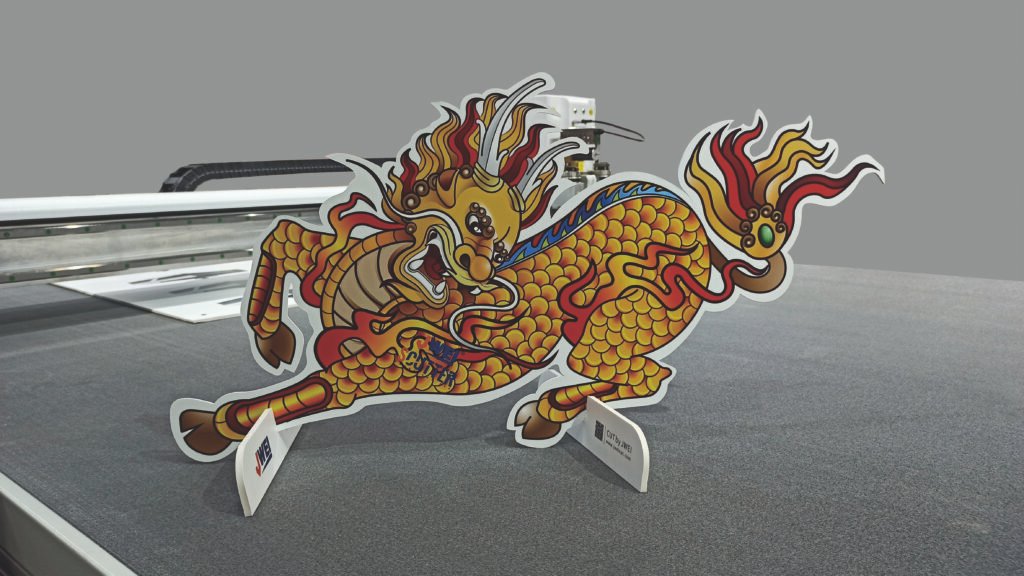 Dragon-shaped cutout made using JWEI TB08II cutter with JWCS software, by Printers Media Plus, LLC.